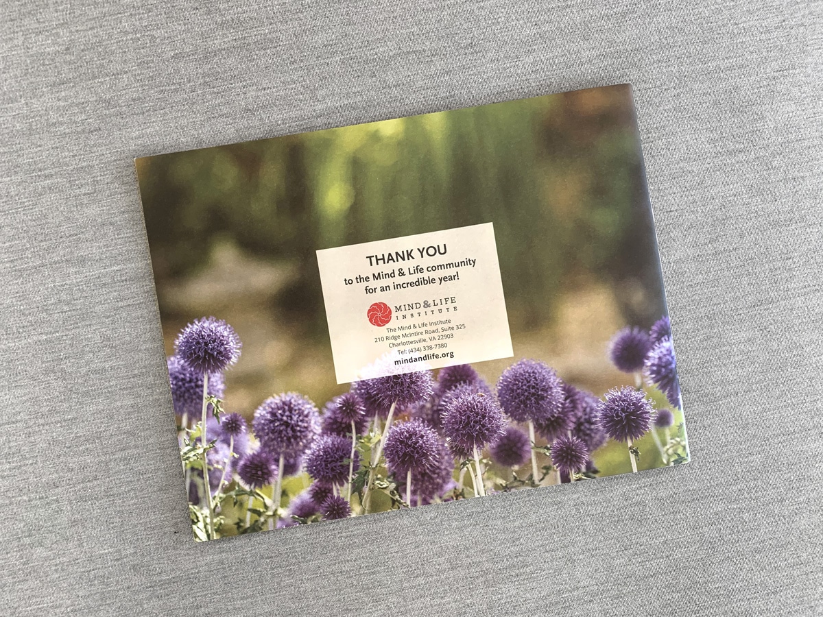 Annual report back cover design with purple flowers